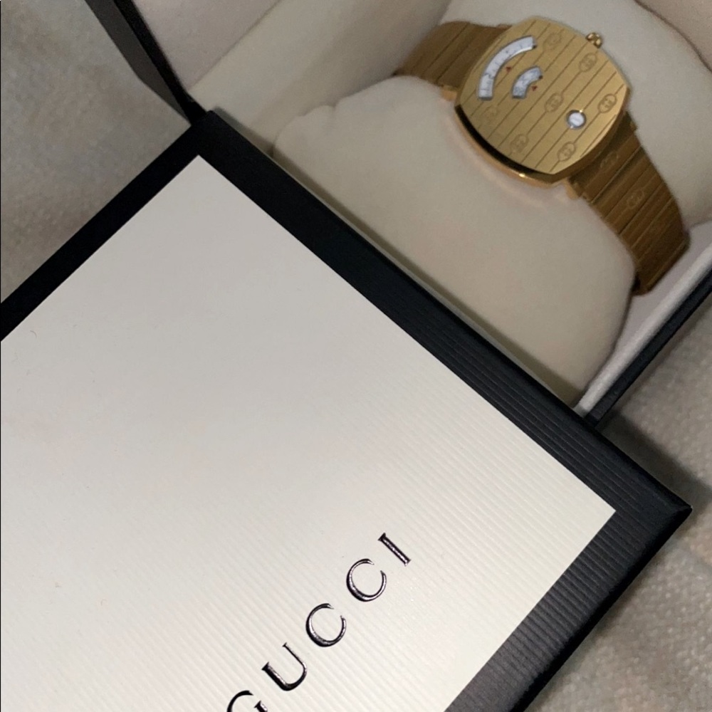 Men’s Gucci Grip monogram watch in gold like new!